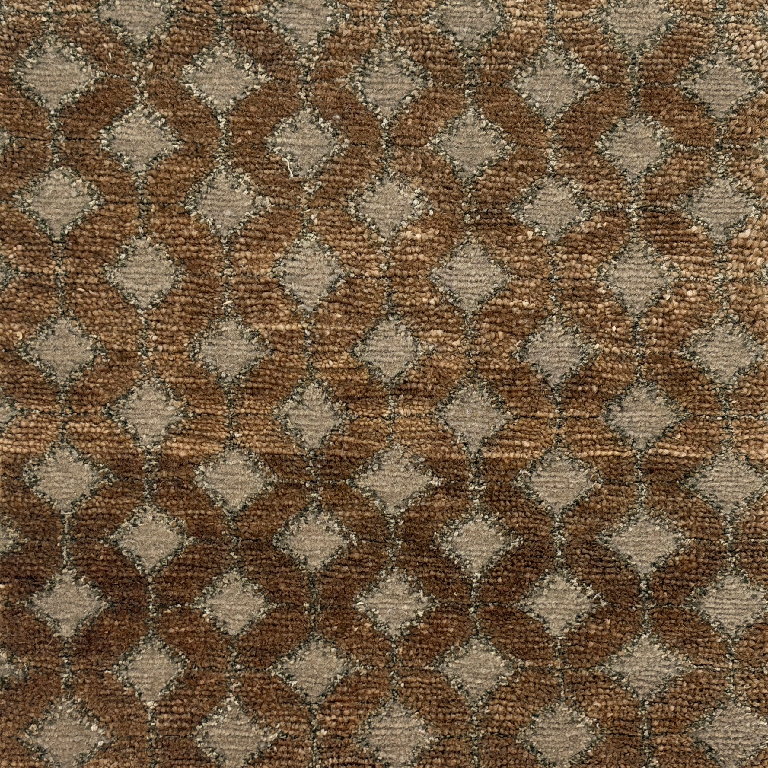 Handknotted rug with a diamond lattice design in grey on a brown field. 