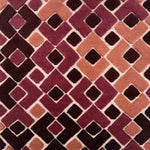 Handknotted rug with raised arrow design in shades of pink, wine and dusty rose. 