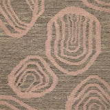 Handwoven rug with geometric pattern in grey and pink tones