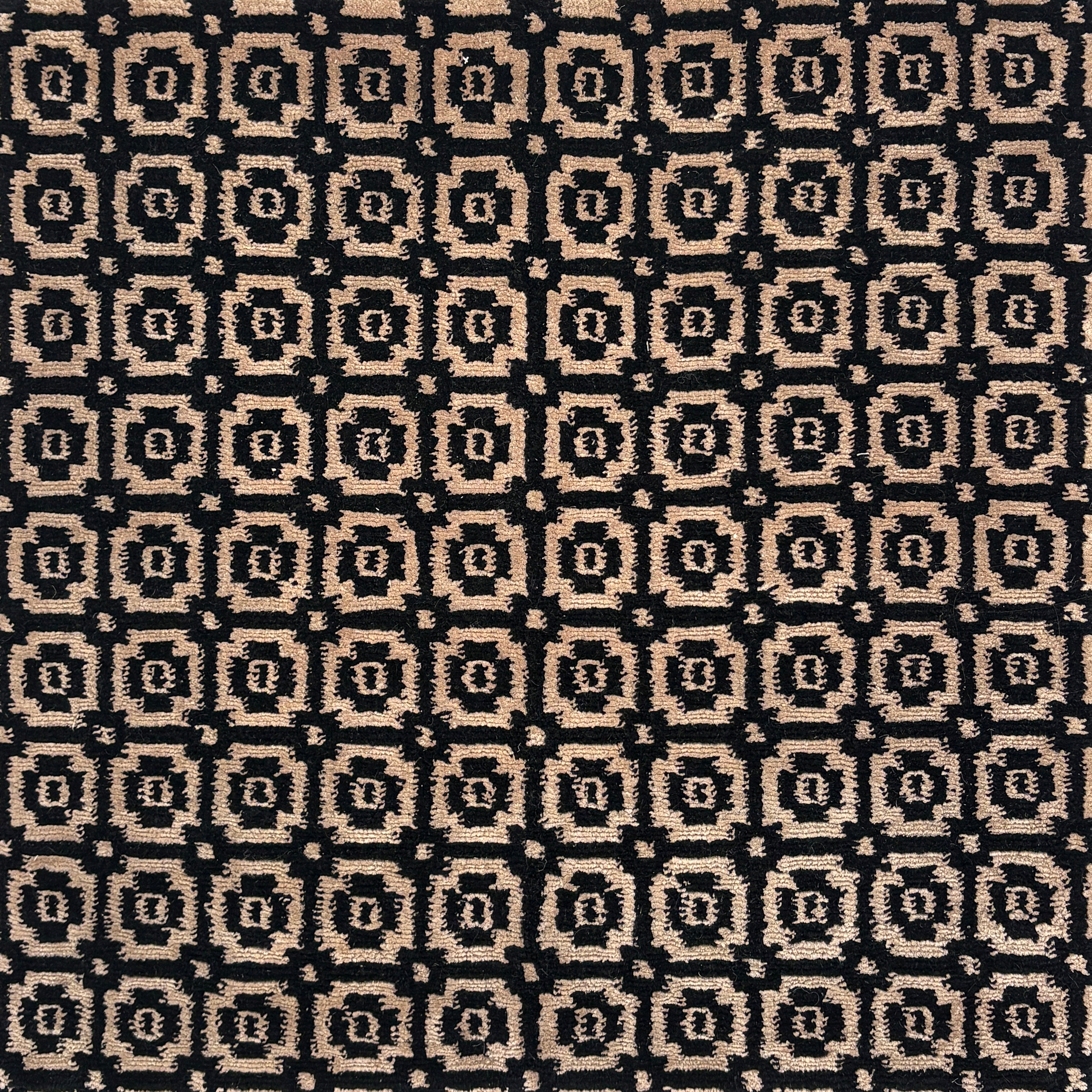 Patterned fabric with black and beige geometric design