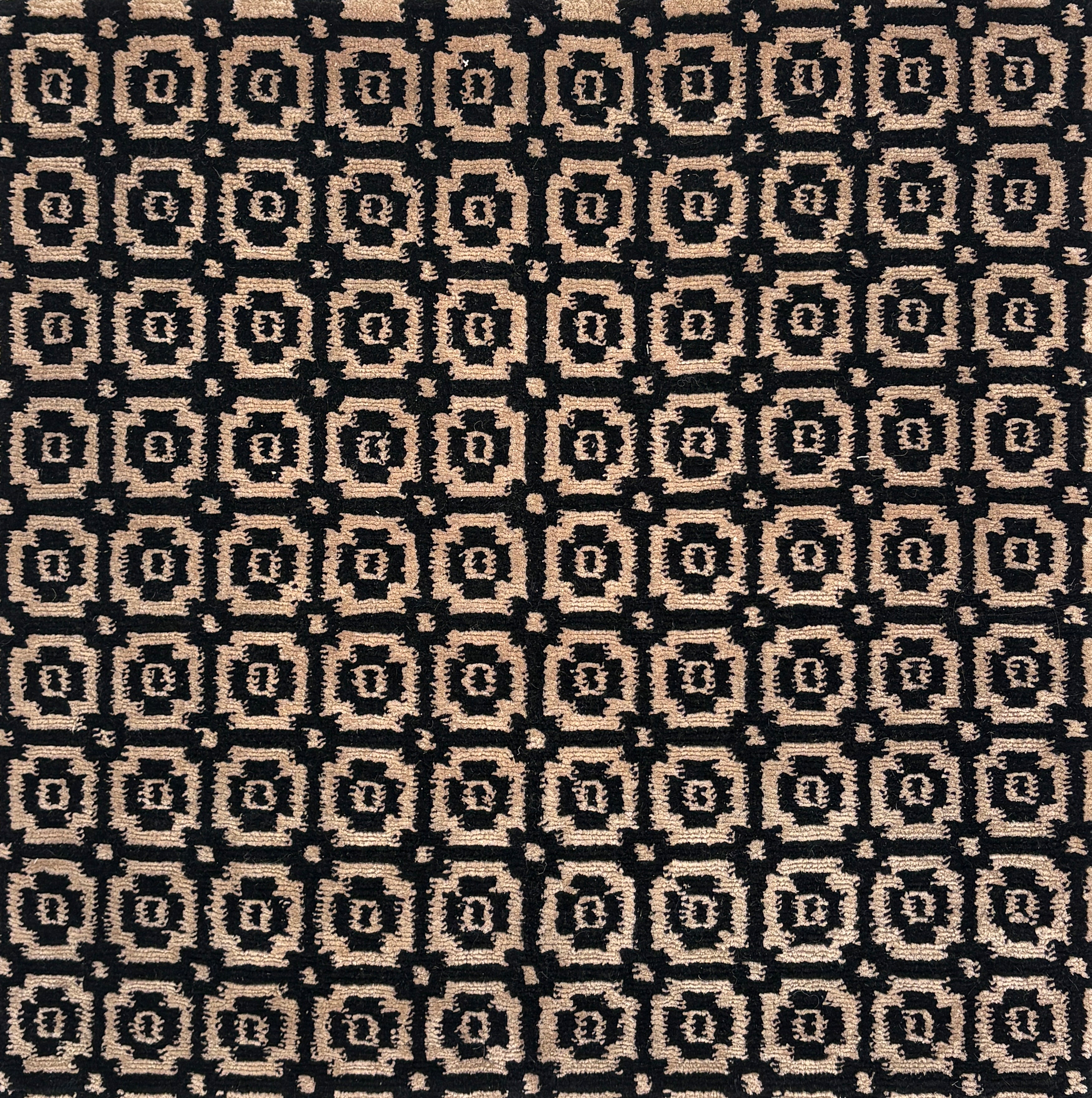 Patterned fabric with black and beige geometric design