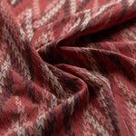Close-up of patterned fabric with red and beige colors
