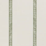 Detail of a linen fabric in a minimal geometric linear pattern in sage on a cream field.