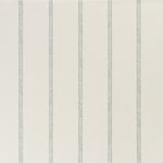 printed linen fabric in a minimal geometric linear pattern in dusty blue on a cream field.