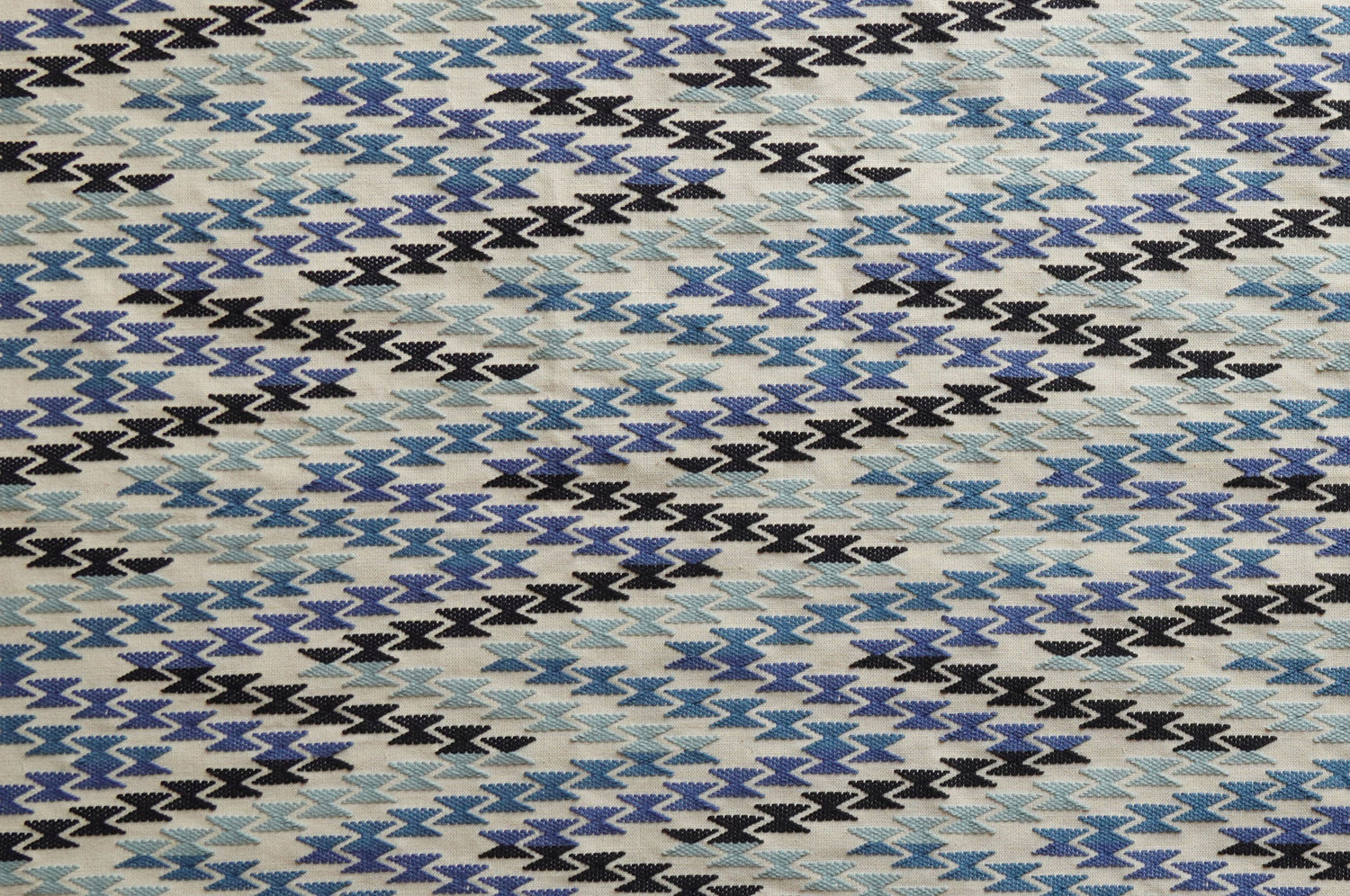 Patterned fabric with black, blue, and gray design