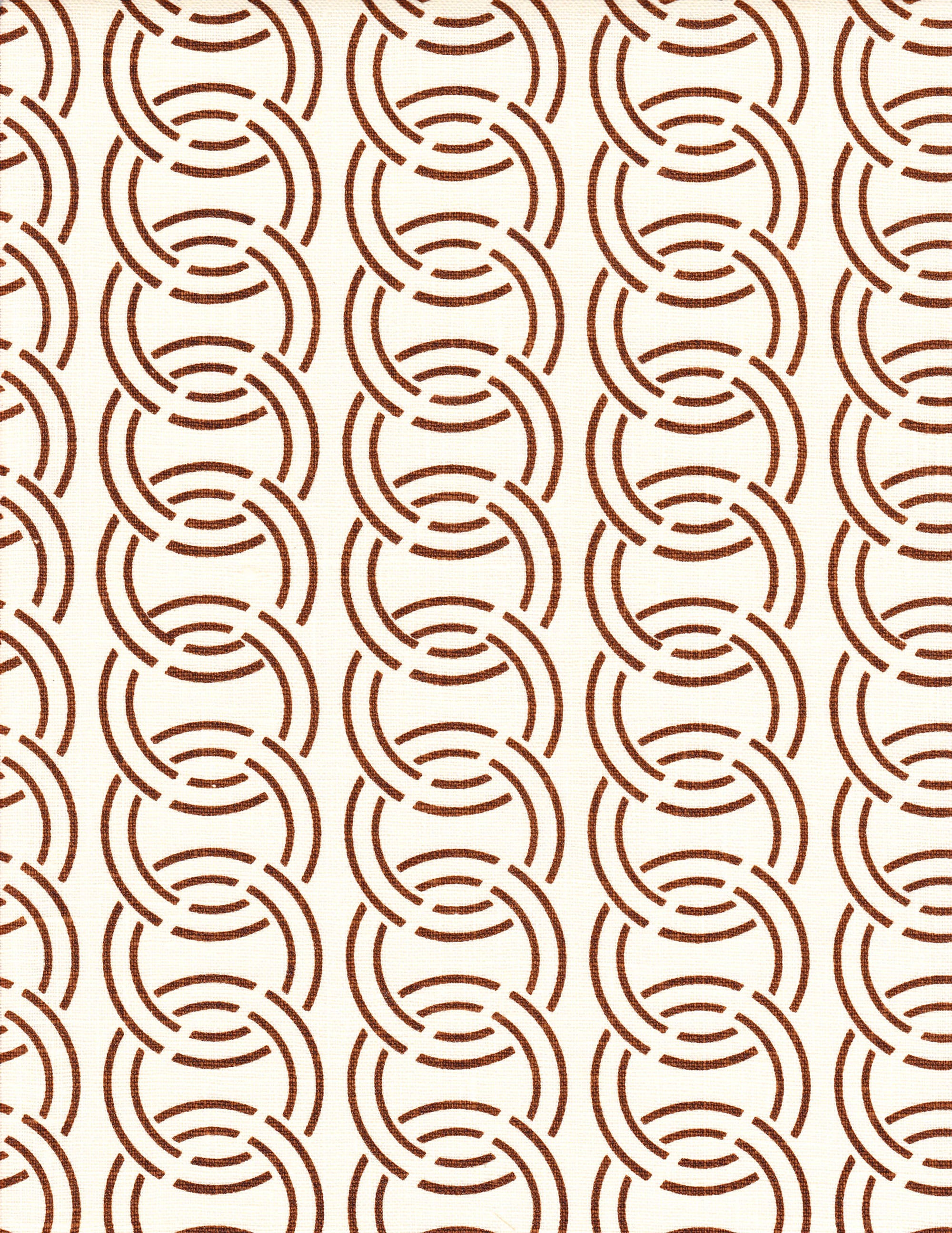 Detail of fabric in an interlocking circular pattern in brown on a cream field.