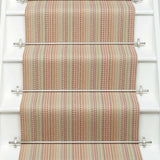 Striped flatweave runner in red green blue orange on white staircase