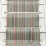 Striped flatweave runner in green pink blue red on white staircase