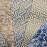 Collection of broadloom carpet swatches with geometric patterns in various colors.