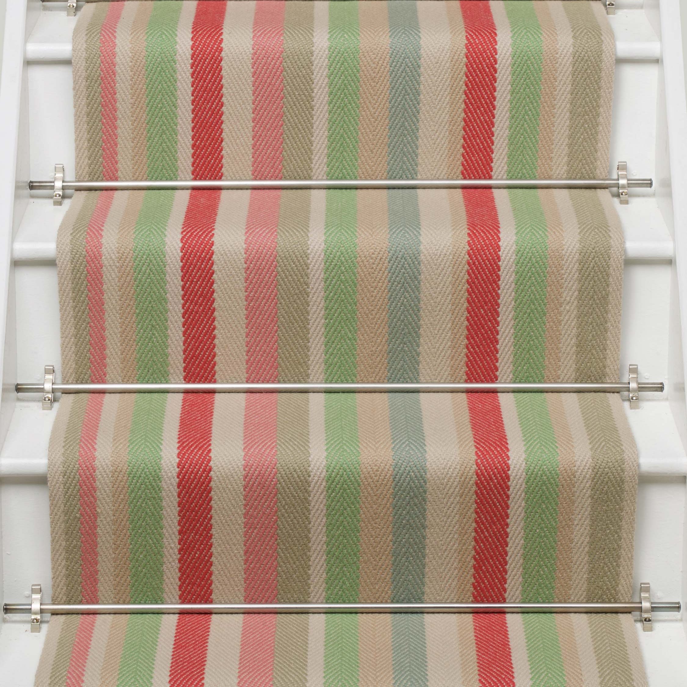 Striped flatweave runner in green pink blue red yellow on white staircase