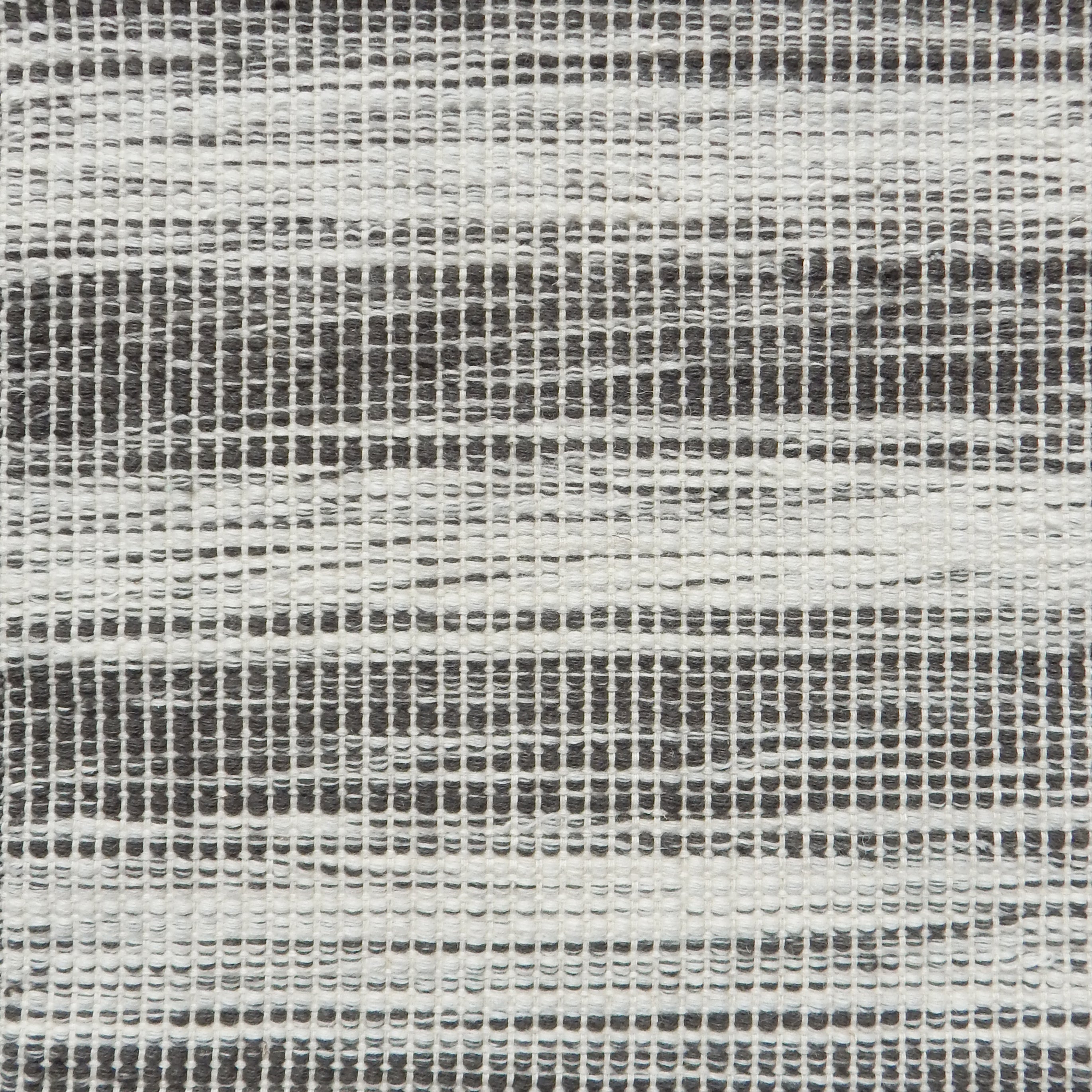 Flatweave rug in a subtle  stripe of white and charcoal