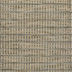Textured rug with a grey and beige checker pattern