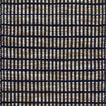 Textured rug with a black and beige  checker pattern