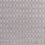 Handwoven wool rug with an oval and diamond lattice pattern in shades of grey and taupe.