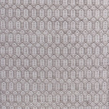 Handwoven wool rug with an oval and diamond lattice pattern in shades of grey and taupe.