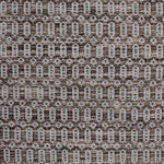 Handwoven wool rug with an oval and diamond lattice pattern in shades of brown and grey-blue. 