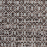 Handwoven wool rug with an oval and diamond lattice pattern in shades of brown and grey-blue. 