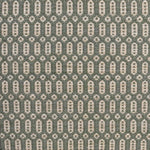 Handwoven wool rug with an oval and diamond lattice pattern in shades of sage green and beige. 