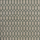Handwoven wool rug with an oval and diamond lattice pattern in shades of sage green and beige. 