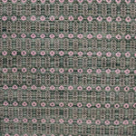 Handwoven wool rug with an oval and diamond lattice pattern in shades of green and brown with pink accents. 