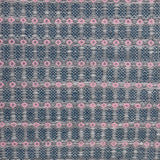 Handwoven wool rug with an oval and diamond lattice pattern in shades of grey and dark blue with pink accents.