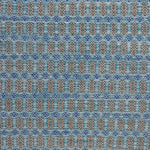 Handwoven wool rug with an oval and diamond lattice pattern in shades of turquoise and brown with blue accents.