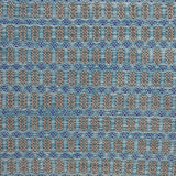 Handwoven wool rug with an oval and diamond lattice pattern in shades of turquoise and brown with blue accents.