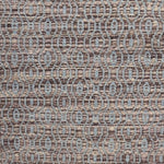 Handwoven wool rug with undulating oval stripe in shades of brown on an grey-blue field. 