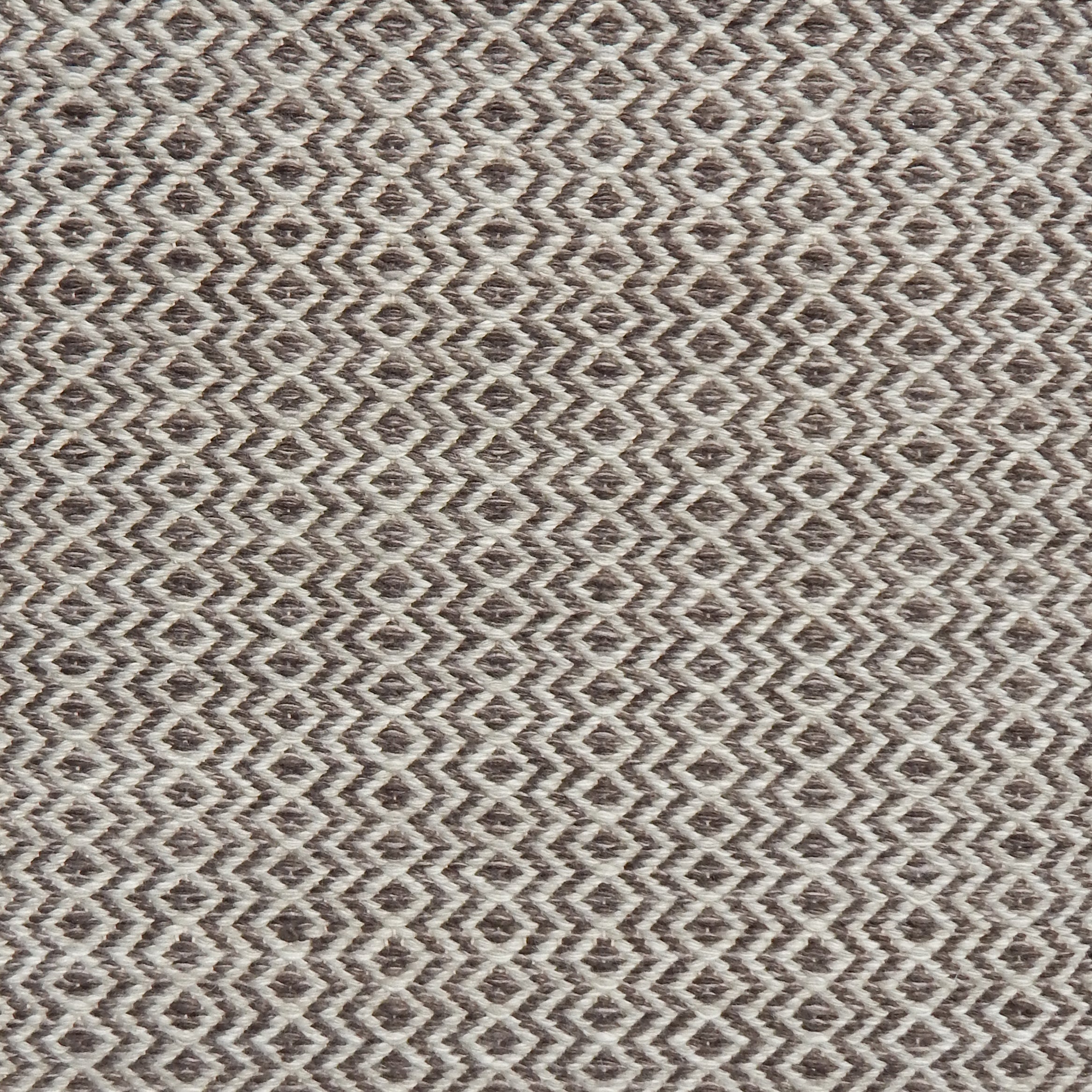 Flatweave rug with an diamond stripe pattern in cream and brown
