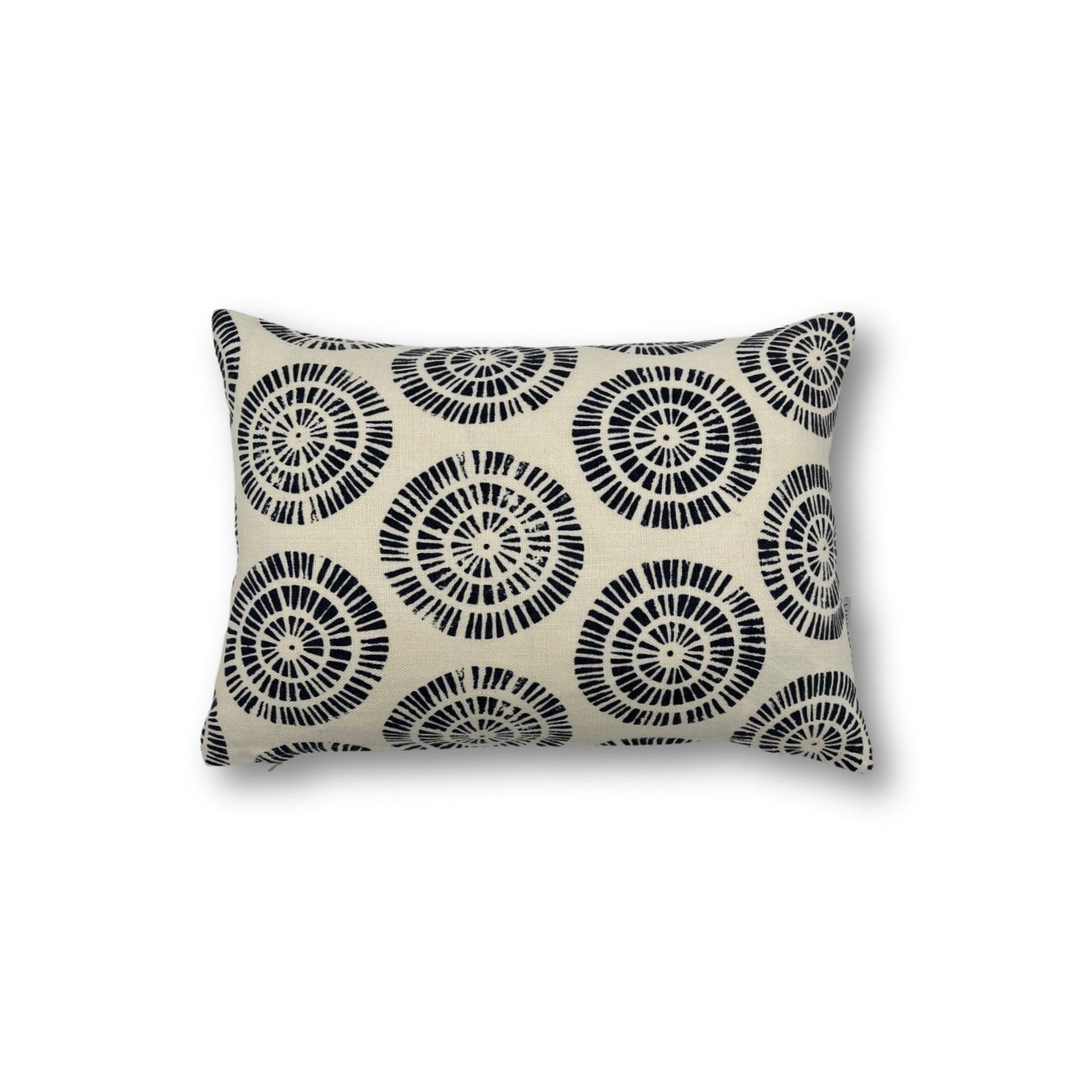 Rectangular throw pillow in a circulart dot pattern made of small dashed lines in navy blue printed on cream linen.
