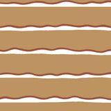 Detail of fabric in a wide undulating stripe pattern in red and white on a light brown field.