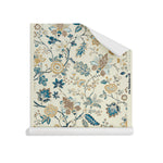 Roll of wallpaper in scrolling floral vine pattern in tan, taupe and shades of blue on cream. 