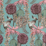 Detail of fabric in a dense floral print in shades of pink, green and yellow on a blue field.