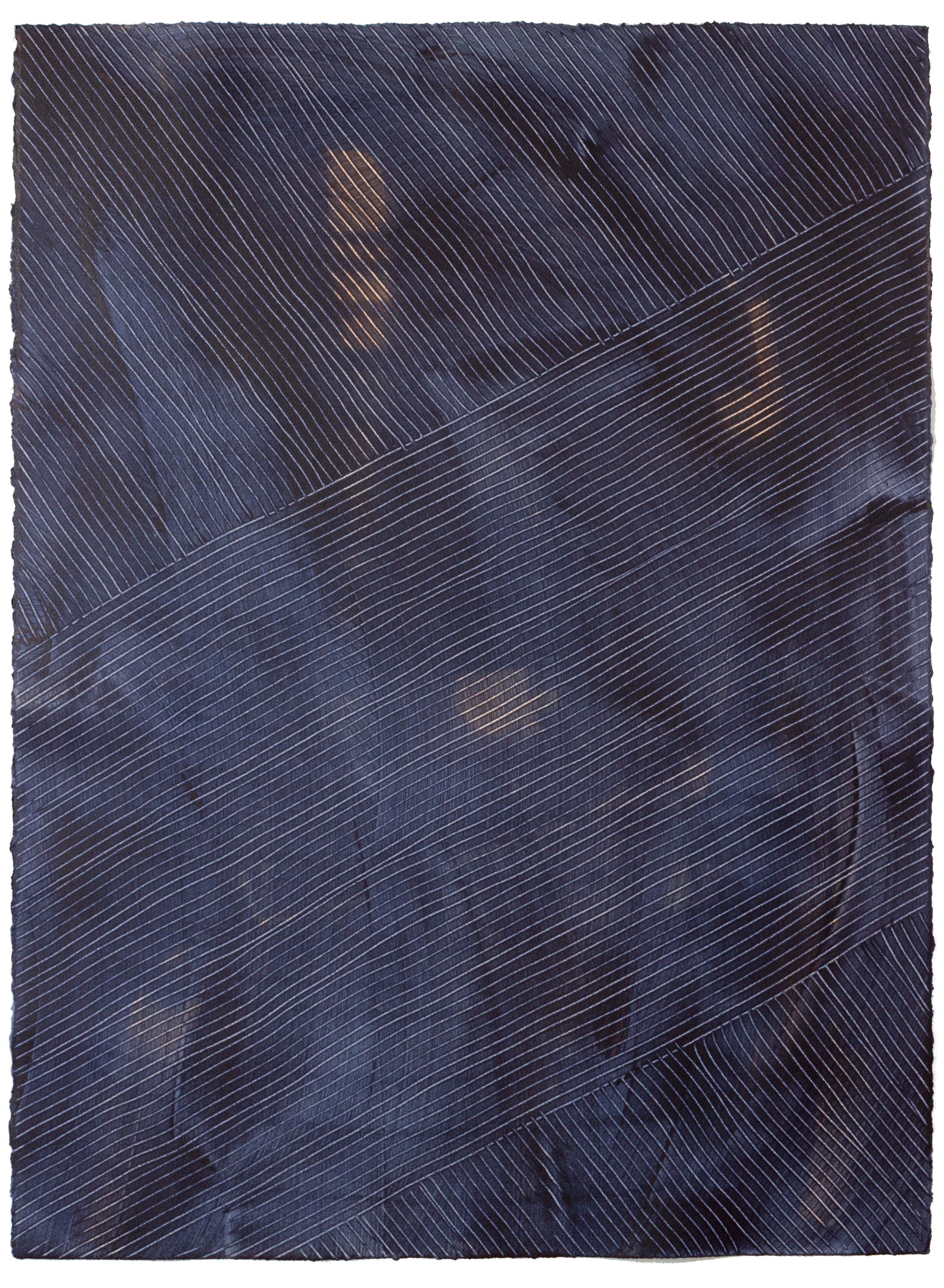 Sheet of handmade wallpaper with a dimensional combed pattern in indigo.