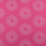 Detail of fabric in a repeating circular geometric print in light gray on a fuchsia field.