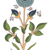 Detail of fabric in a large-scale marigold print in blue, orange and green on a white field.