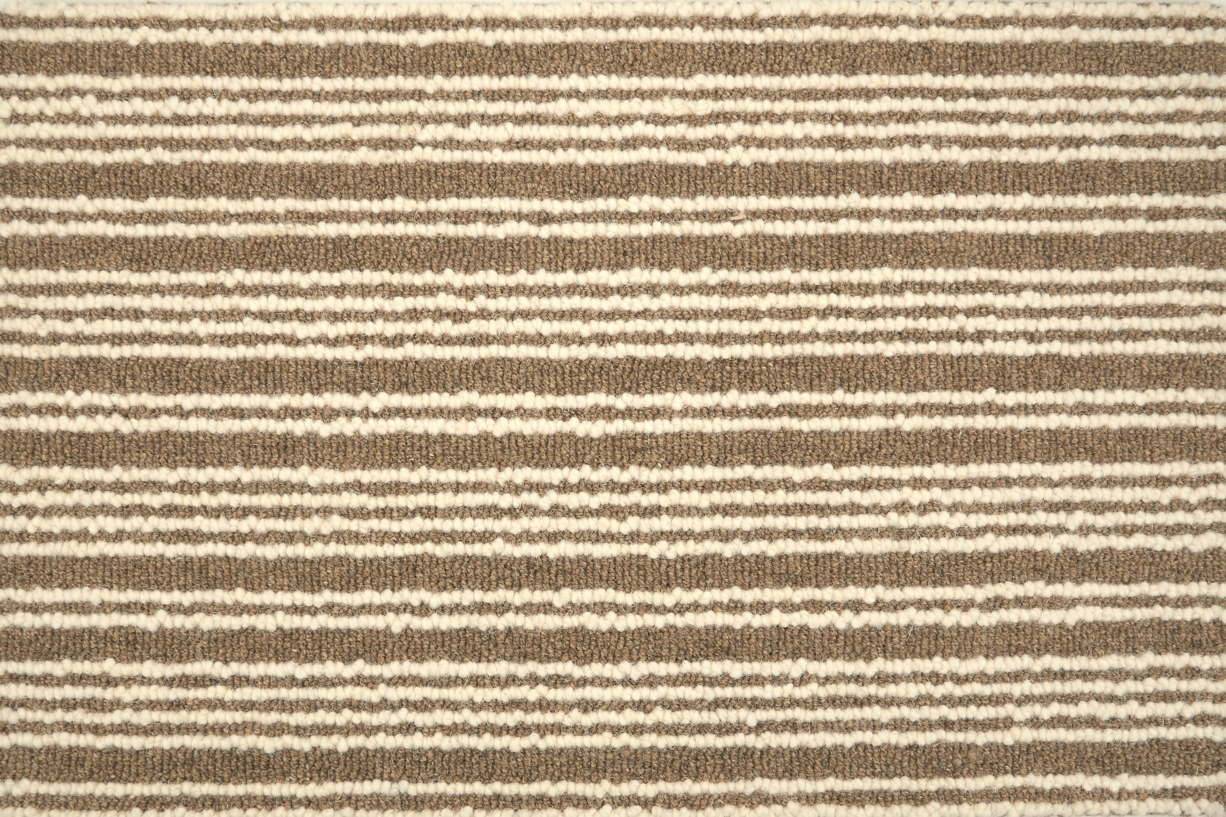 Broadloom carpet with raised cream stripes on brown.