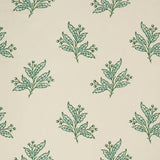 Pattern of green and blue leaf sprigs on a beige background