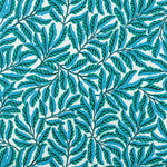Pattern of green leaves on a blue and white background