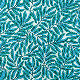 Pattern of green leaves on a blue and white background