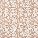 Detail of fabric in an abstract floral print in dusty rose on a cream field.