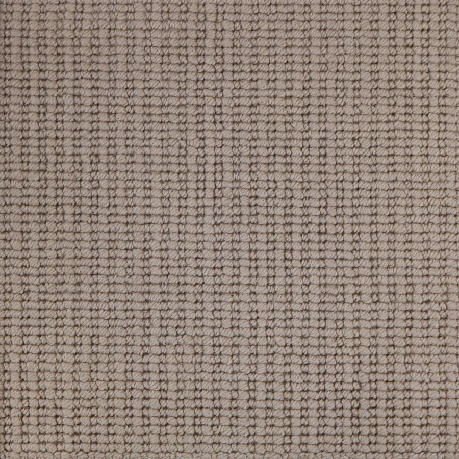 Broadloom carpet with a textural rib in light brown. 