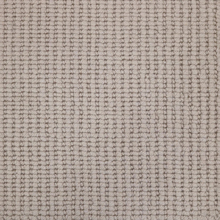 Broadloom carpet with a textural rib in ecru.
