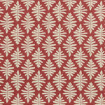 Detail of fabric in a repeating fern leaf print in cream on a dark red field.