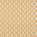 Detail of fabric in a repeating fern leaf print in white on a mustard field.