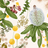 Detail of wallpaper in a large-scale botanical print in shades of pink, yellow and green on a cream field.