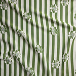 Fabric with green and white striped pattern and floral designs