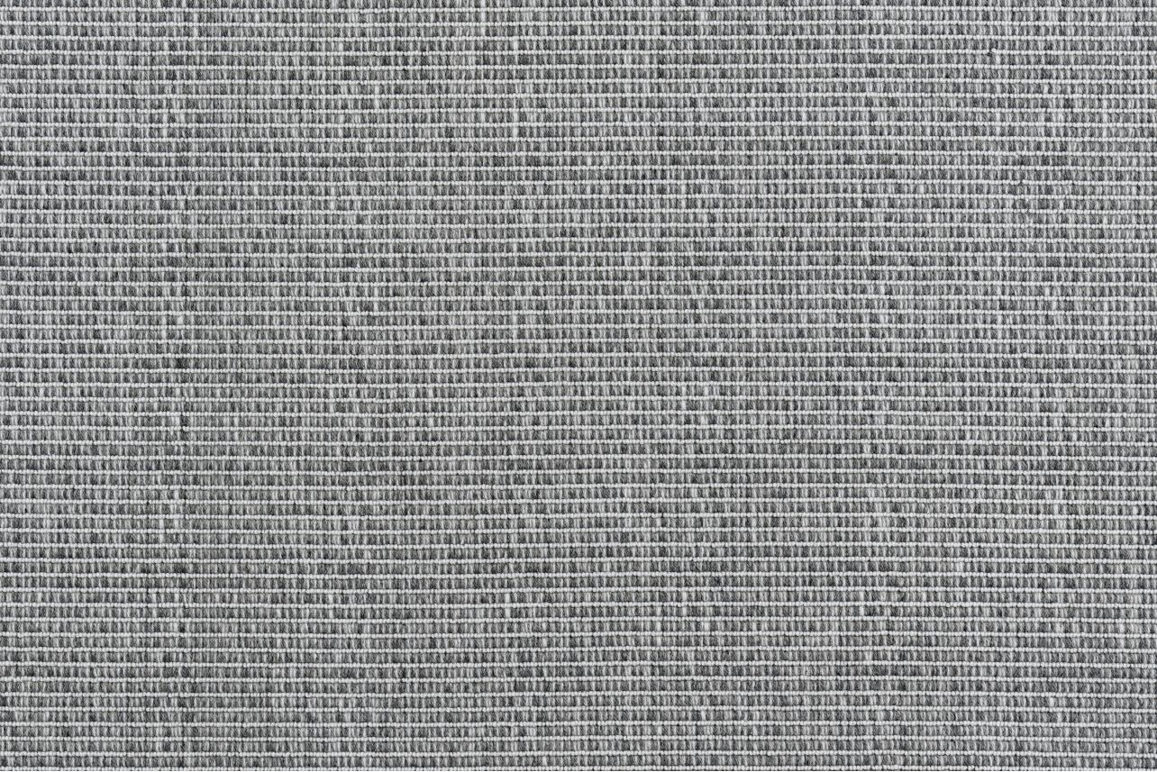 Broadloom carpet in a ribbed stripe in charcoal grey.