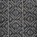 Handwoven rug detail in a diamond design in navy blue and black
