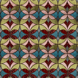 Wallpaper with geometric stained glass pattern pattern with red, turquoise, pink and green. 